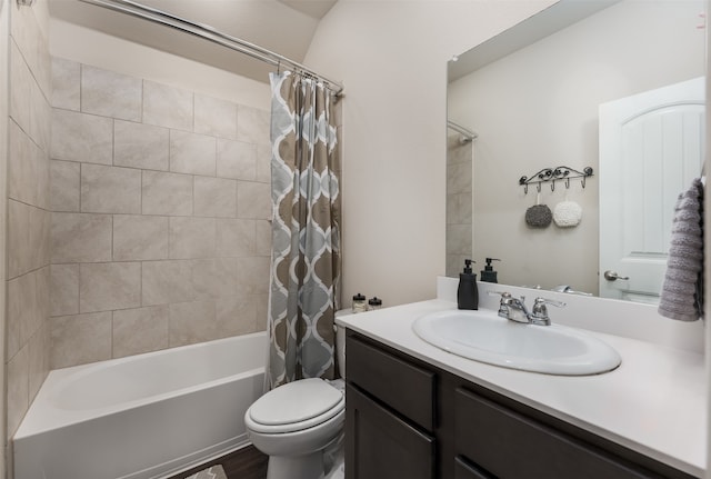 full bathroom with shower / bath combination with curtain, wood-type flooring, vanity, and toilet