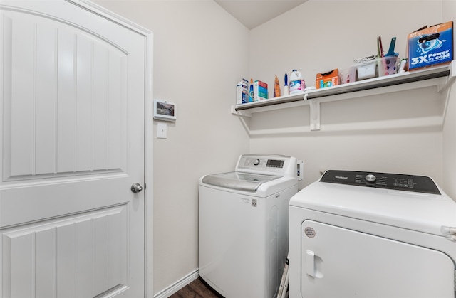 washroom featuring independent washer and dryer and dark wood-type flooring