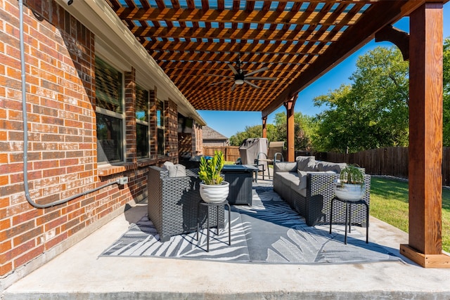 view of patio with ceiling fan, an outdoor hangout area, a storage shed, and a pergola