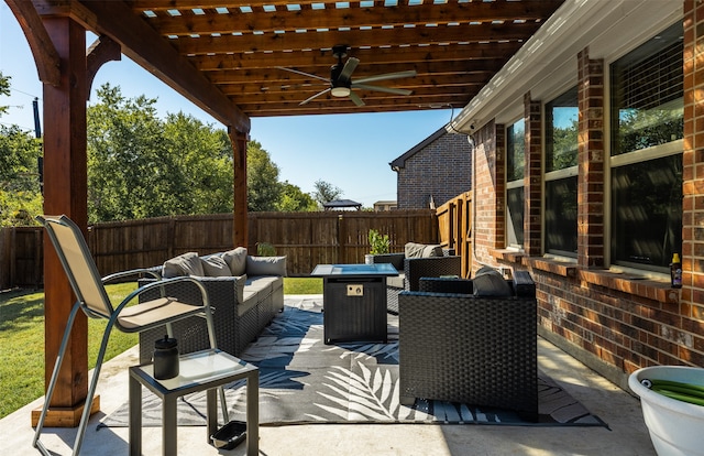 view of patio / terrace with ceiling fan, an outdoor living space, and a pergola