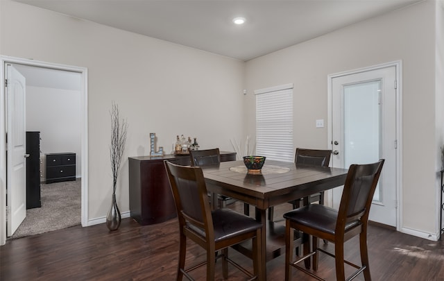 dining space featuring dark hardwood / wood-style flooring