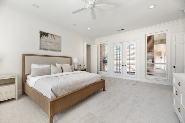 carpeted bedroom with ceiling fan, ornamental molding, french doors, and access to exterior