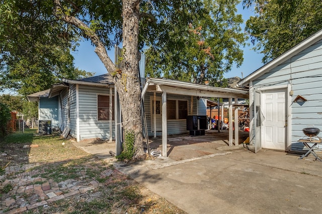 exterior space featuring a patio and central AC