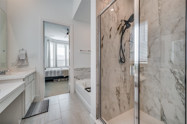 bathroom with ceiling fan, tile patterned flooring, vanity, and independent shower and bath