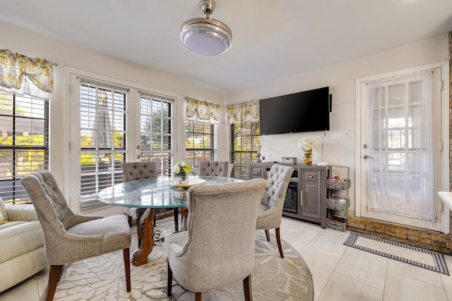 dining space featuring light tile patterned floors