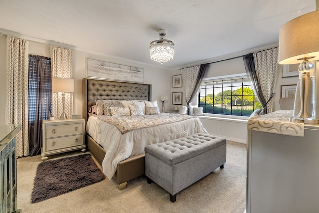 bedroom featuring ornamental molding and light carpet