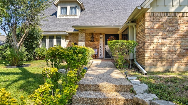 property entrance featuring a porch and a yard