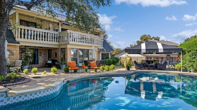 view of swimming pool with a patio