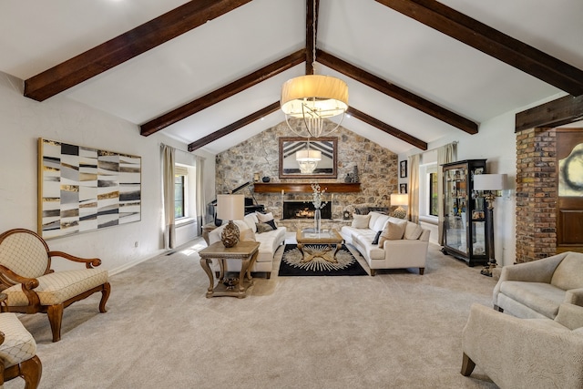 living room with a stone fireplace, a chandelier, vaulted ceiling with beams, and light carpet