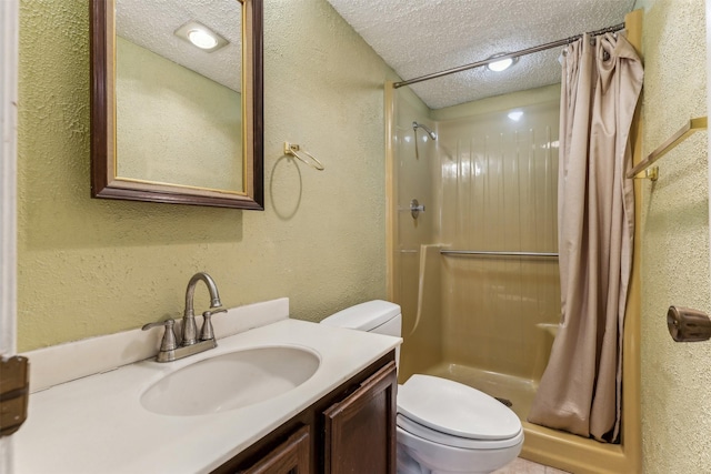 bathroom featuring vanity, toilet, a textured ceiling, and a shower with curtain