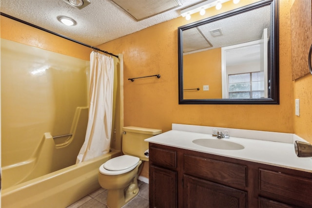 full bathroom featuring tile patterned flooring, vanity, a textured ceiling, toilet, and shower / bath combo with shower curtain