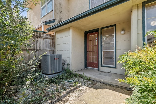 doorway to property featuring central AC