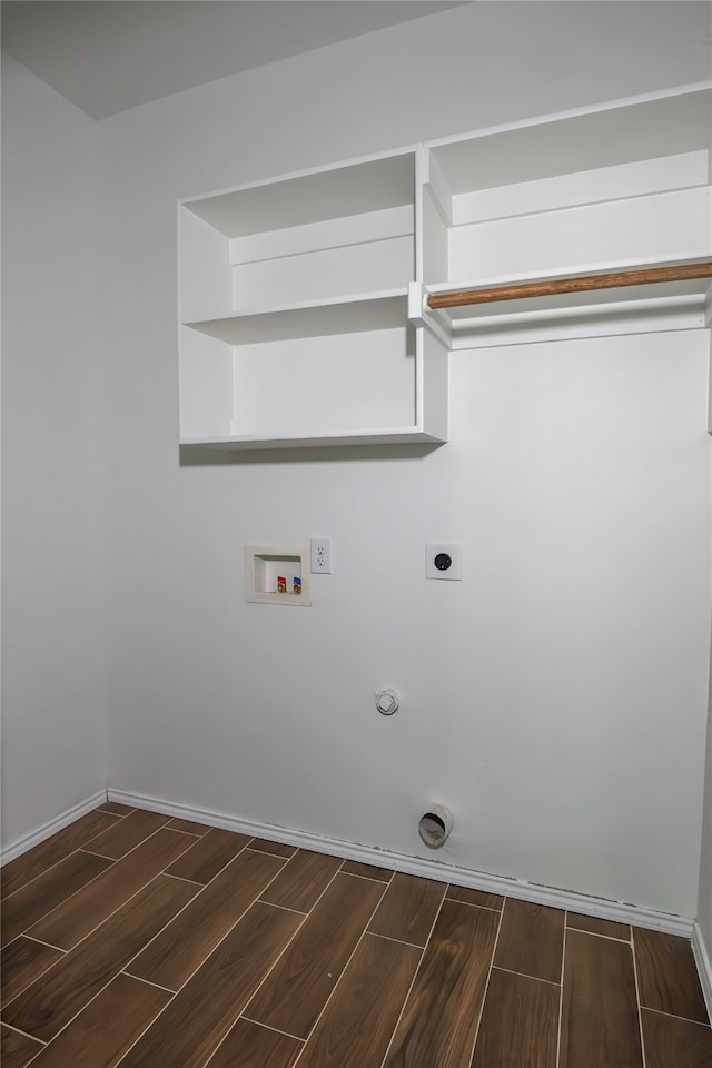 laundry area featuring hookup for a washing machine, hookup for a gas dryer, dark hardwood / wood-style flooring, and hookup for an electric dryer