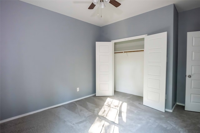 unfurnished bedroom featuring ceiling fan, a closet, and carpet