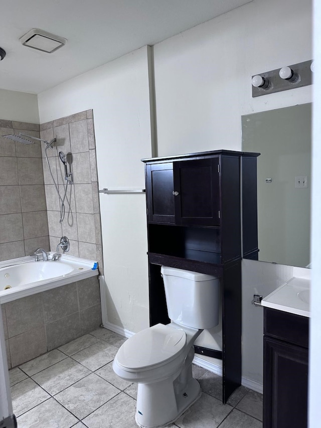 full bathroom with tile patterned floors, vanity, toilet, and tiled shower / bath