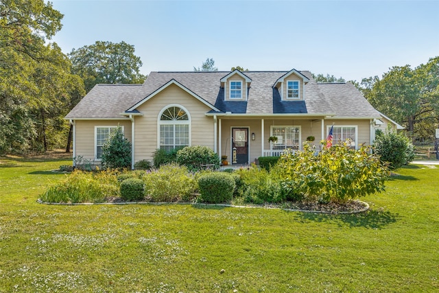 cape cod home with a porch and a front yard