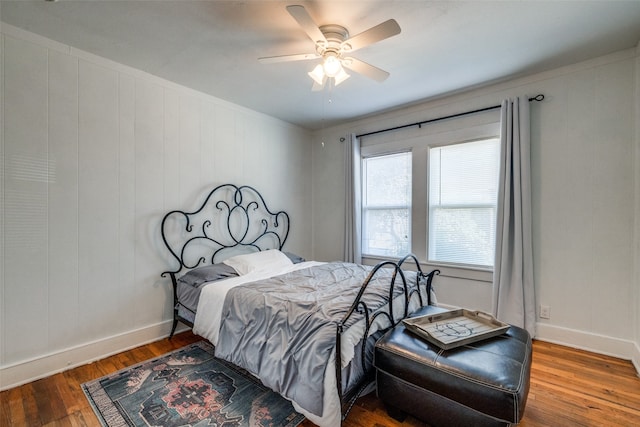 bedroom with ceiling fan and hardwood / wood-style floors