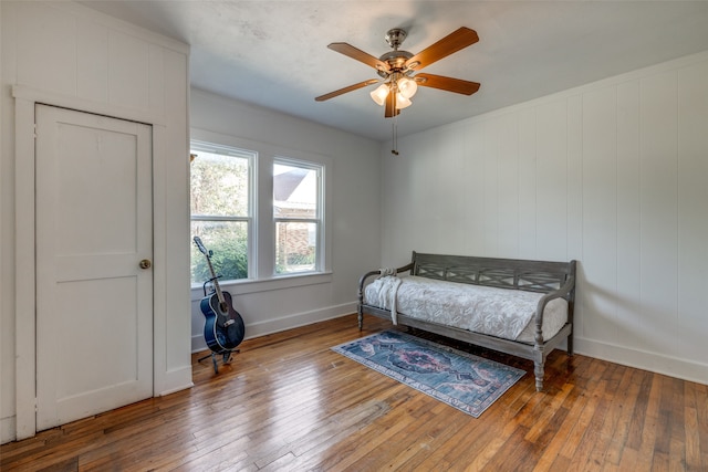 bedroom with ceiling fan and hardwood / wood-style floors