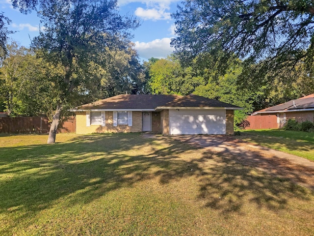 single story home with a garage and a front yard