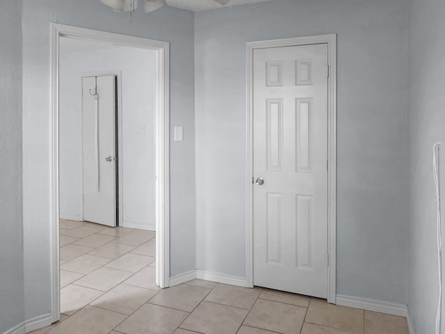 hallway with light tile patterned flooring