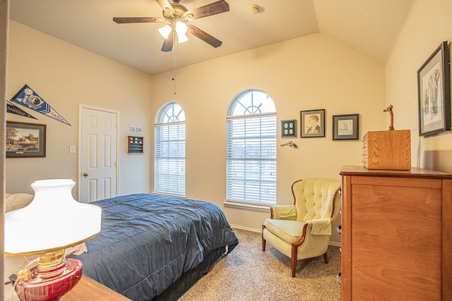 bedroom featuring ceiling fan, light colored carpet, and lofted ceiling