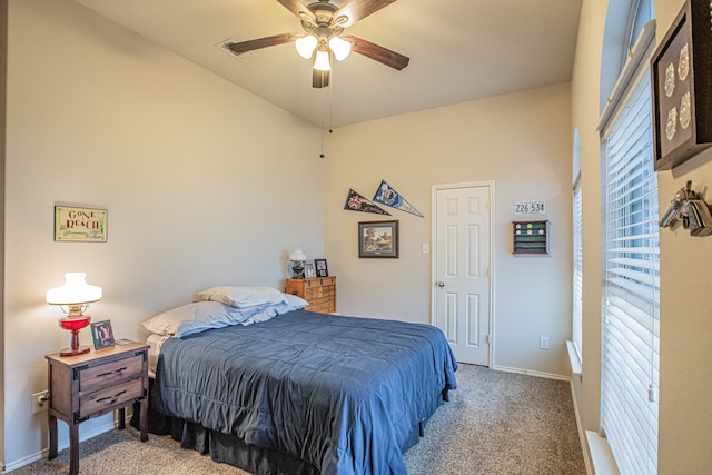 bedroom featuring light colored carpet and ceiling fan