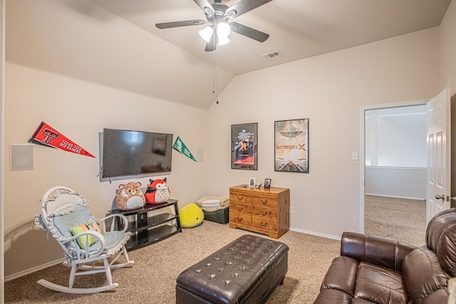 carpeted living room with ceiling fan and lofted ceiling