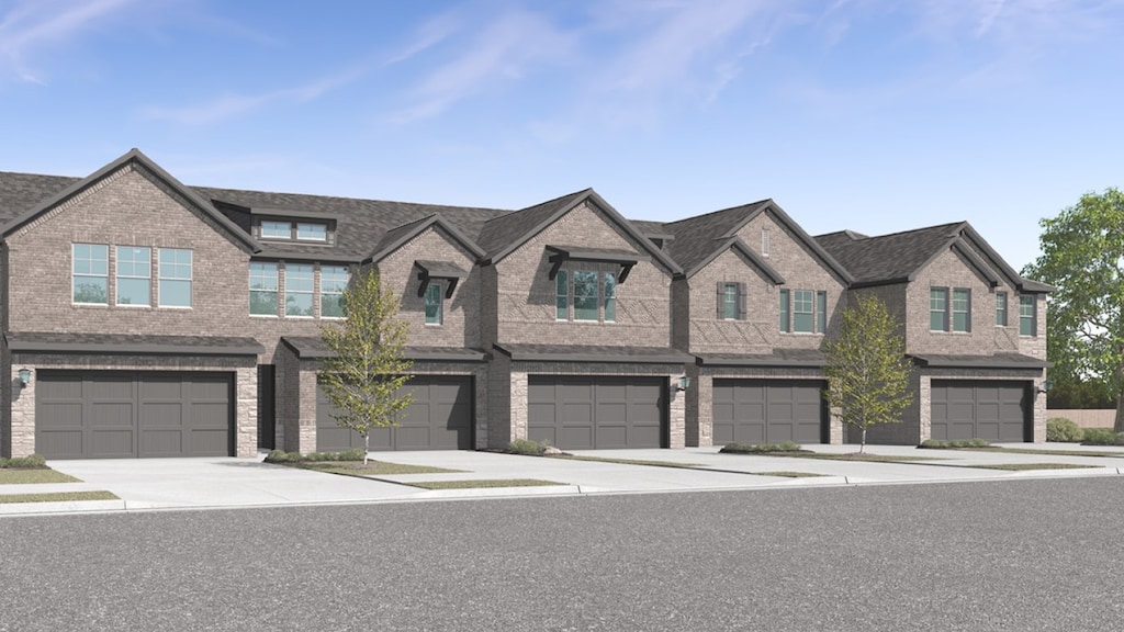 townhome / multi-family property with a garage