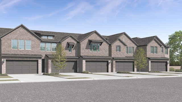 townhome / multi-family property with a garage