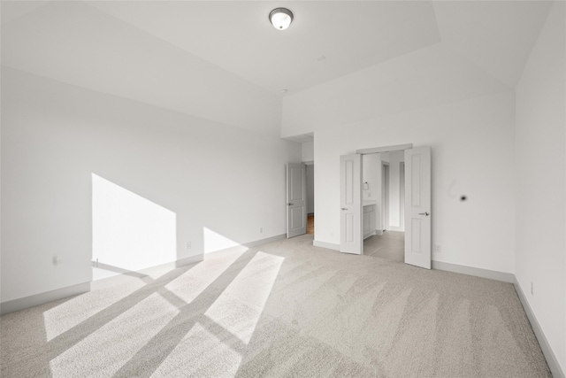 spare room with light colored carpet