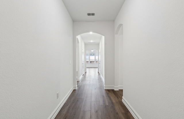 hallway featuring dark wood-type flooring