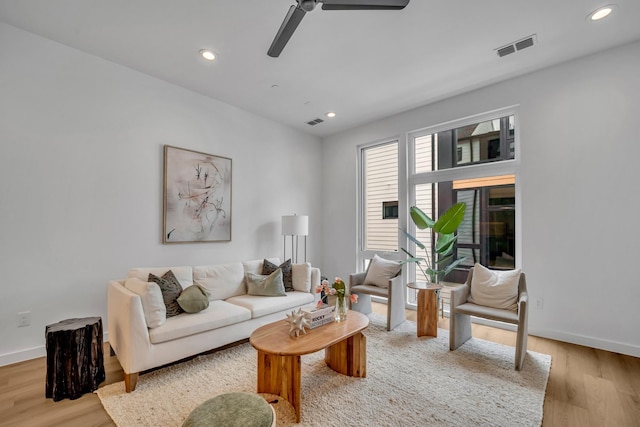 living area featuring recessed lighting, visible vents, and light wood-style floors