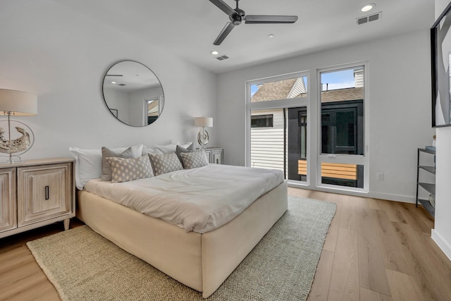 bedroom with light wood-type flooring, access to exterior, visible vents, and recessed lighting