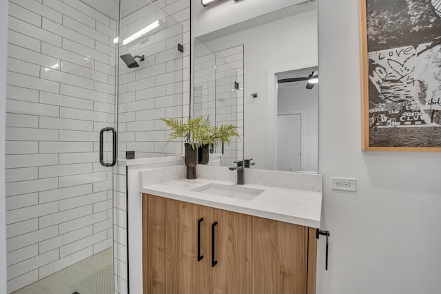 bathroom with a stall shower and vanity