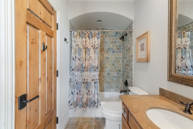 full bathroom featuring tile patterned flooring, shower / bath combination with curtain, vanity, and toilet