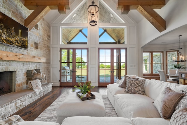 living room with french doors, dark wood-type flooring, high vaulted ceiling, beamed ceiling, and plenty of natural light