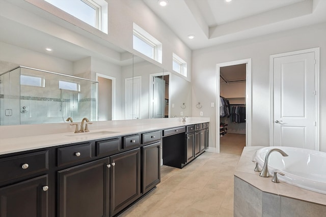 bathroom featuring tile patterned flooring, separate shower and tub, and vanity