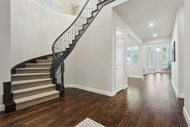 stairs featuring french doors and hardwood / wood-style flooring