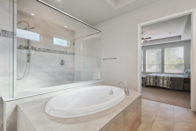 bathroom featuring ceiling fan, plus walk in shower, and tile patterned floors