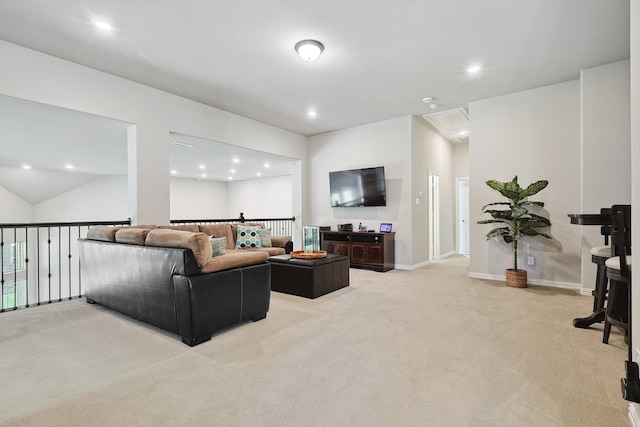 carpeted living room with vaulted ceiling