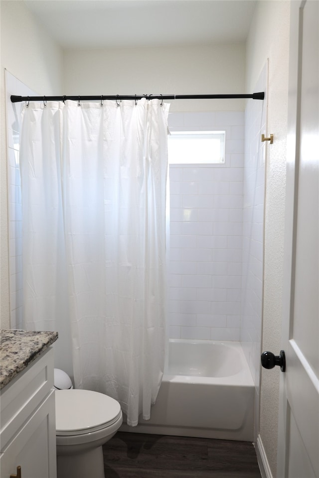 full bathroom with vanity, hardwood / wood-style floors, toilet, and shower / bathtub combination with curtain