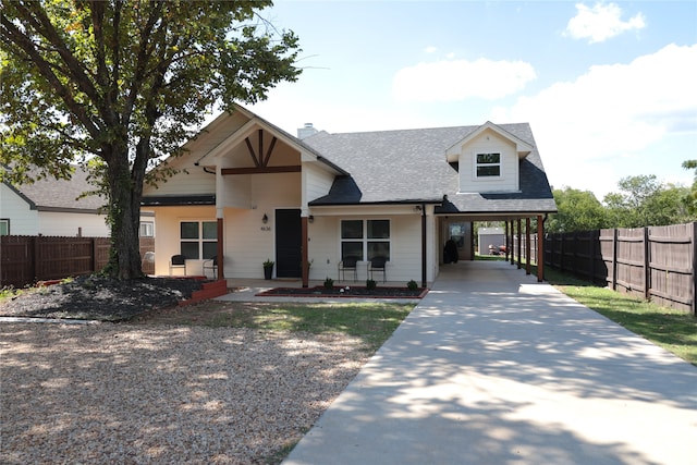 view of front facade with a carport and covered porch