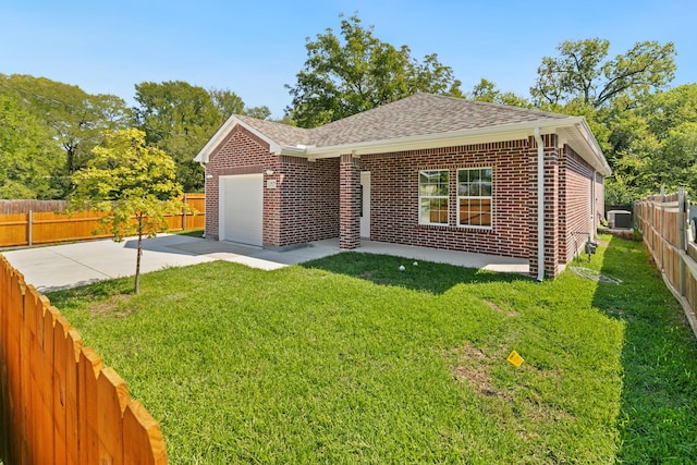 view of front of house featuring central AC unit, a garage, a front lawn, and a patio area