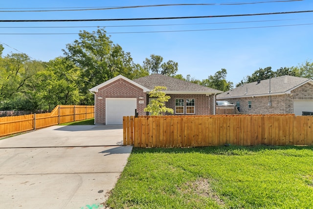 ranch-style home with a garage and a front lawn