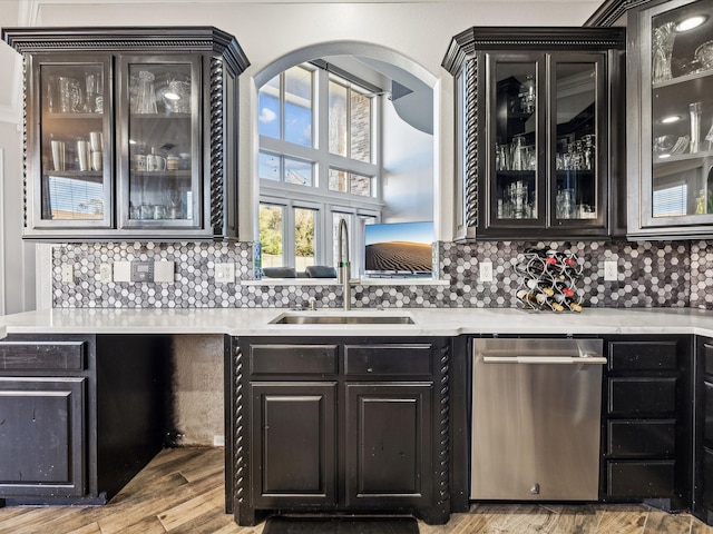 kitchen with premium range hood, tasteful backsplash, light hardwood / wood-style flooring, and appliances with stainless steel finishes