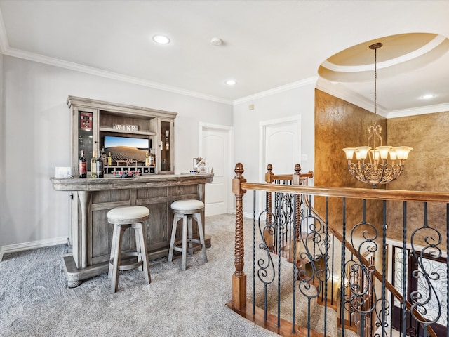 bar with carpet flooring, crown molding, decorative light fixtures, and a notable chandelier