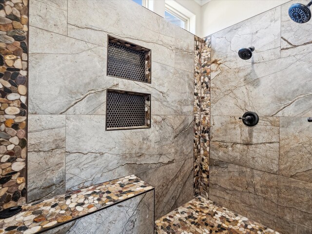 bathroom featuring tiled shower