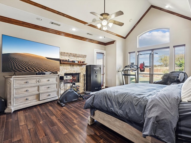 bedroom with high vaulted ceiling, crown molding, ceiling fan, a fireplace, and dark hardwood / wood-style flooring