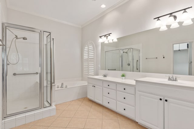 bathroom featuring tile patterned flooring, vanity, crown molding, and plus walk in shower