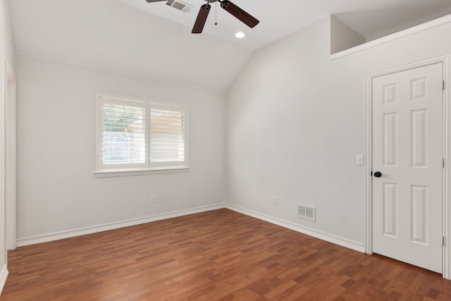 empty room with hardwood / wood-style floors, ceiling fan, and lofted ceiling